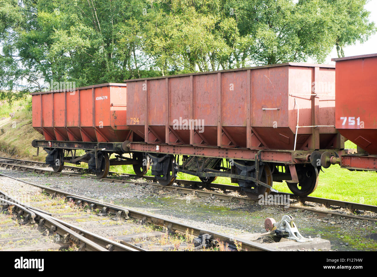 Empty coal train carriage on a railway track. Stock Photo