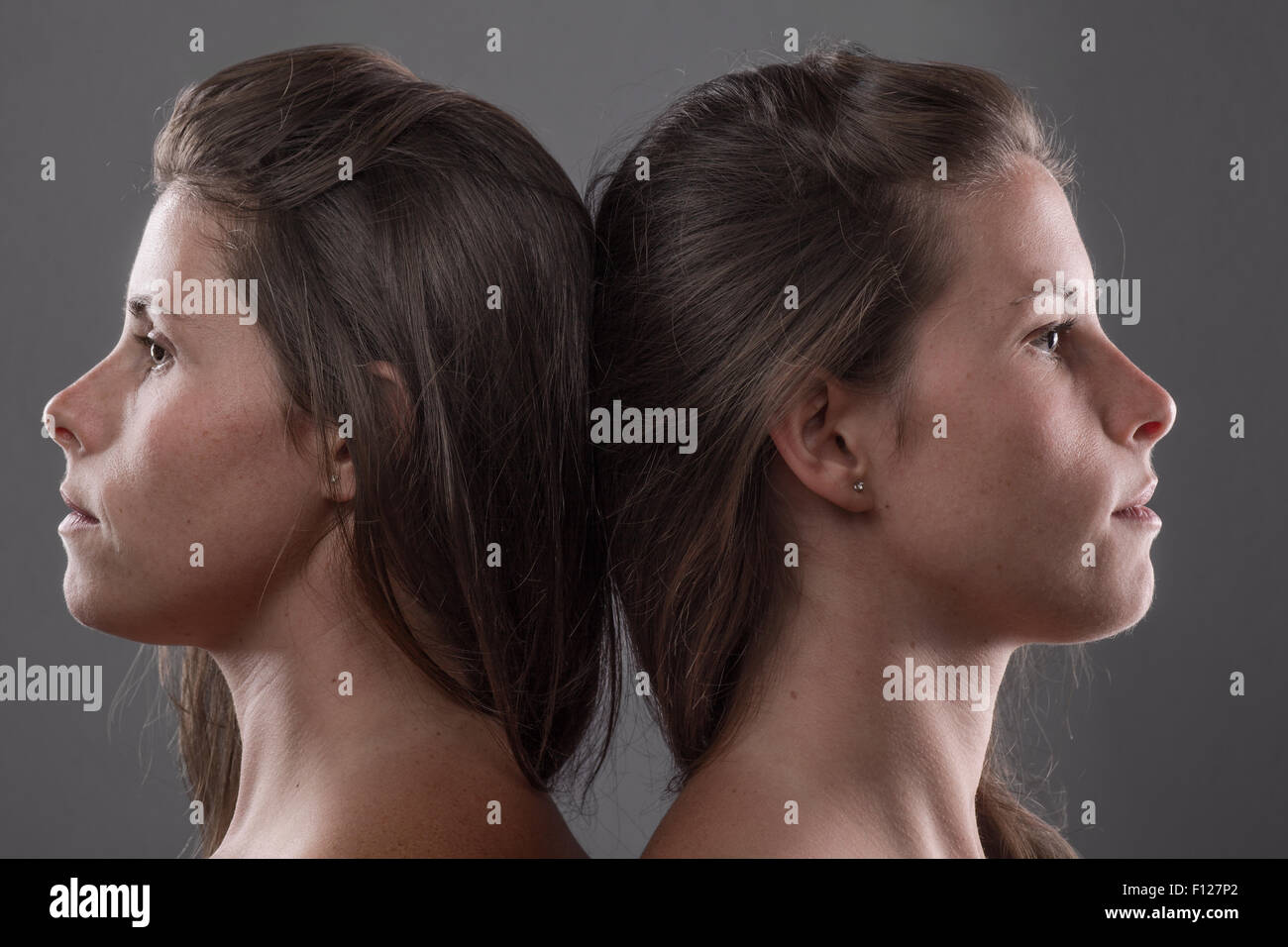 Two Serious Twin Sisters’ Profile Stock Photo - Alamy