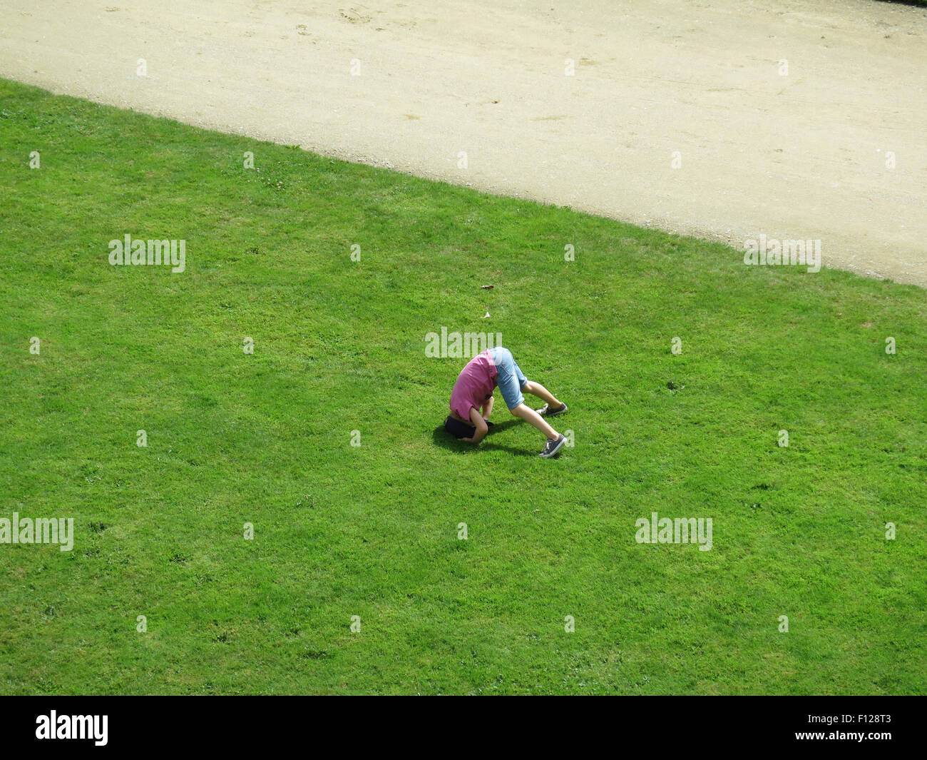 Vannes: boy on grass in 'Jardin des Remparts' Stock Photo