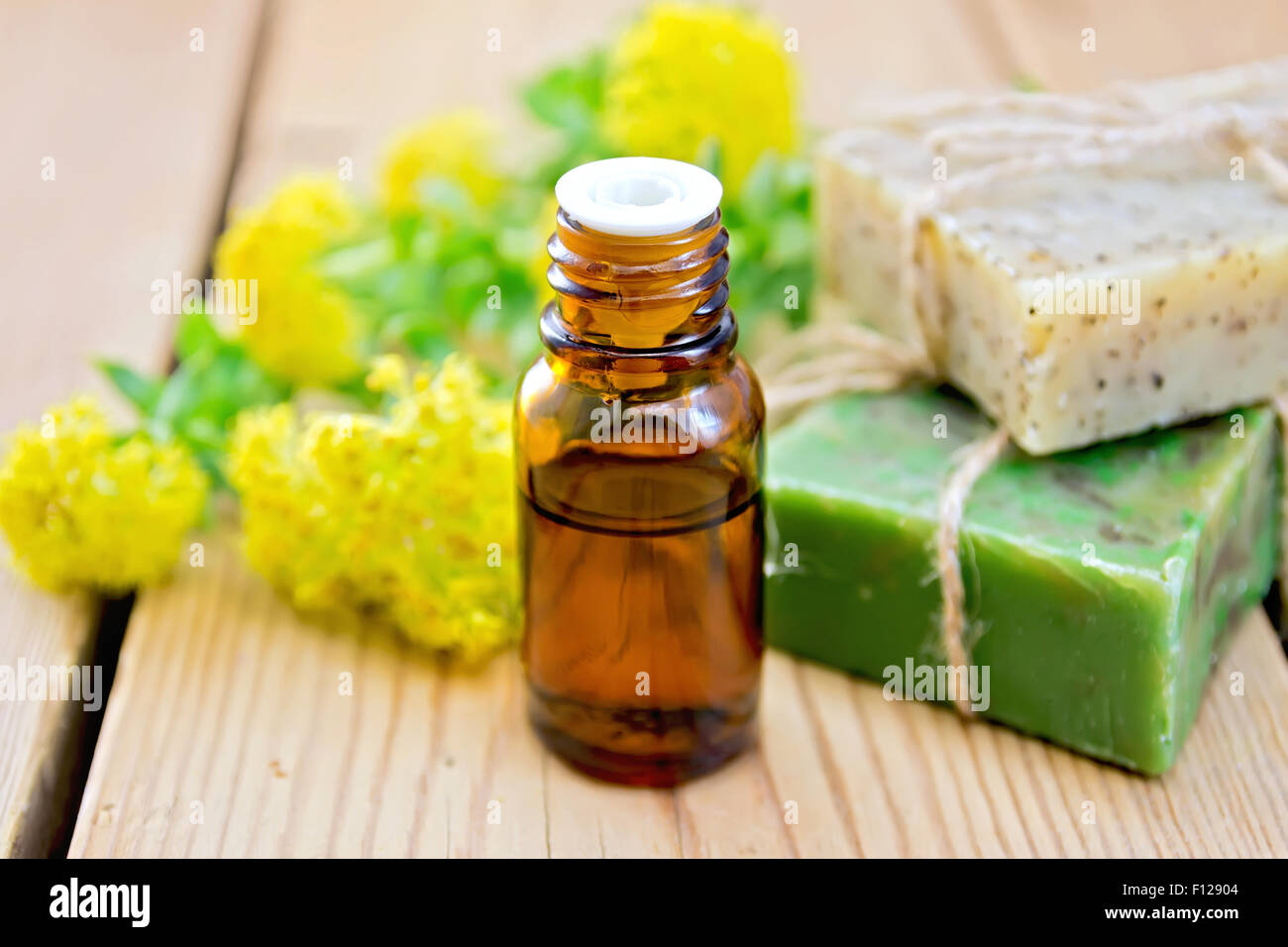 Oil and soap with Rhodiola rosea on board Stock Photo
