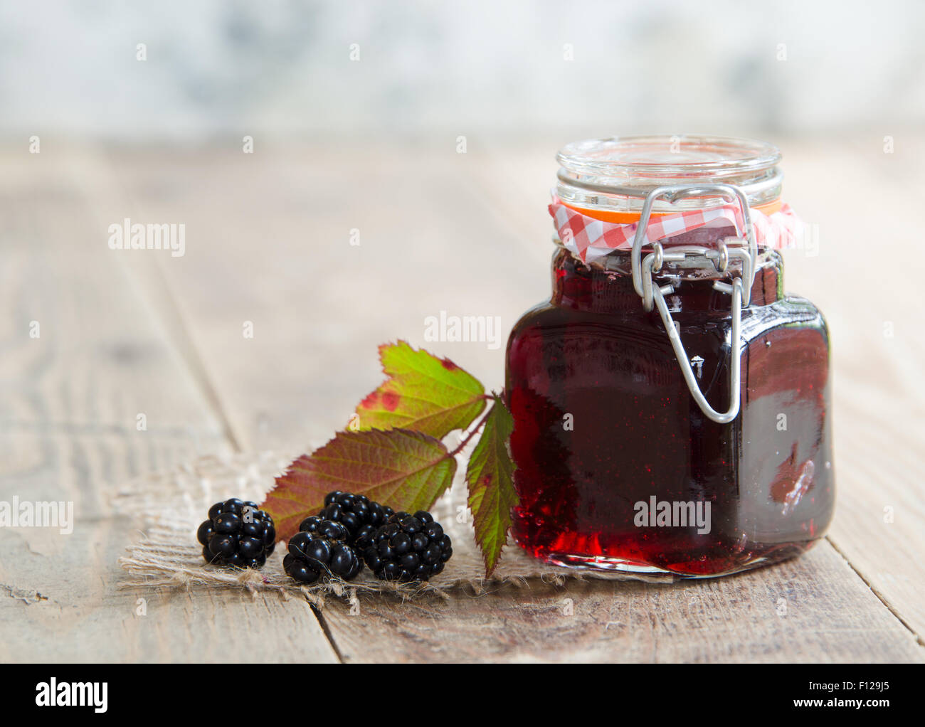 A jar of homemade jam from Blackberries foraged from the hedgerow Stock Photo