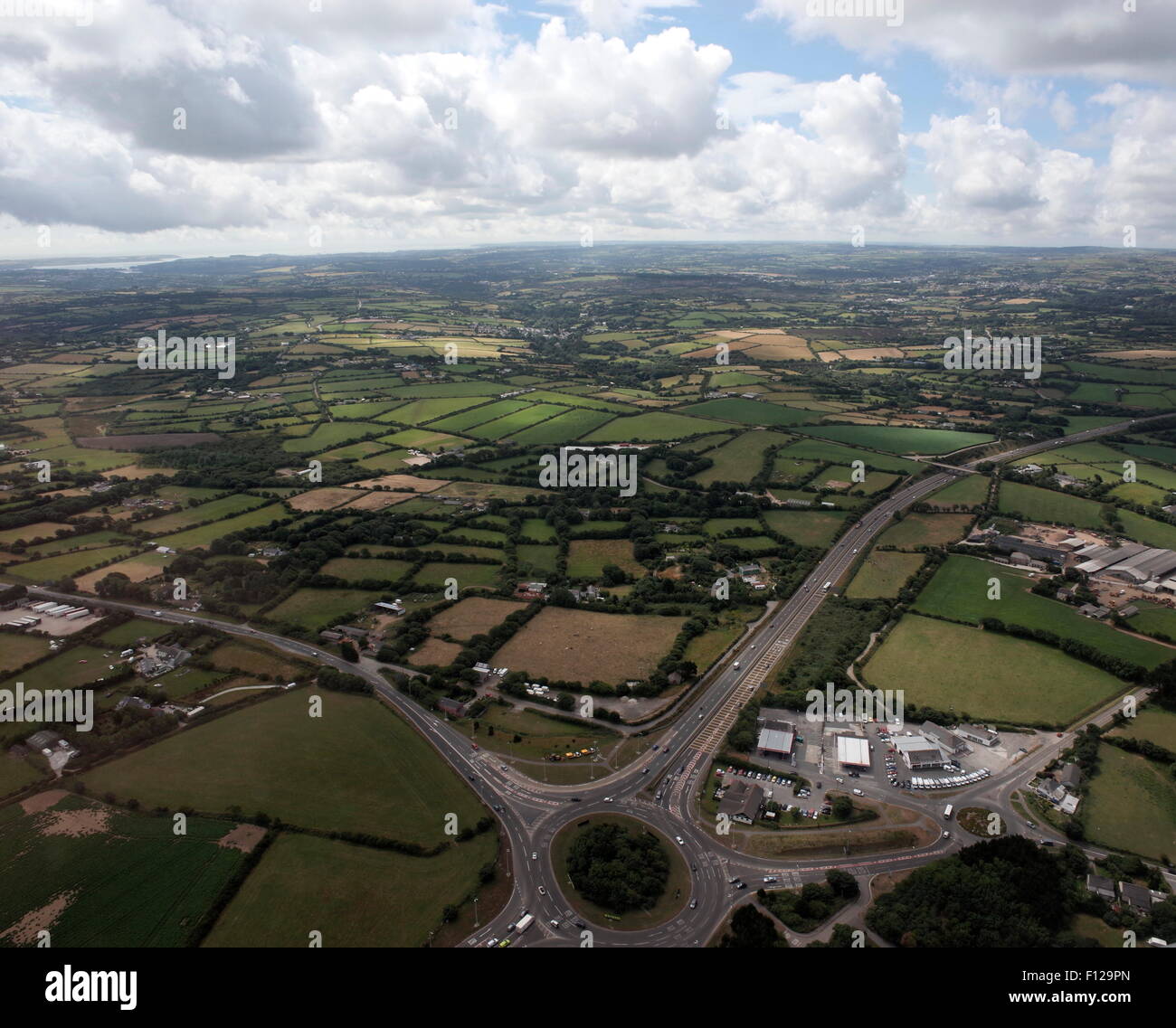 AJAXNETPHOTO. 2013. THREE BURROWS, CHIVERTON CROSS, CORNWALL, ENGLAND. - AERIAL VIEW - OF ROUNDABOUT AND ROAD INFRASTRUCTURE LOOKING SOUTH WEST WITH COASTLINE DISTANT.  PHOTO:JONATHAN EASTLAND/AJAX REF:GR132307 325 Stock Photo
