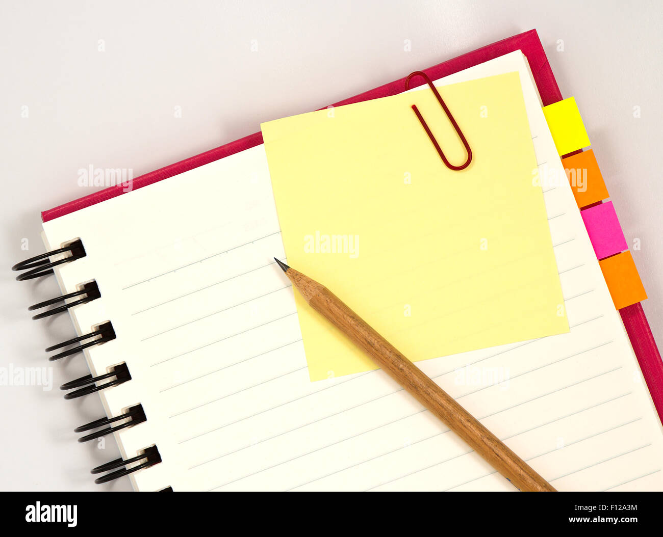 Red notebook with notepad isolated on white background Stock Photo - Alamy
