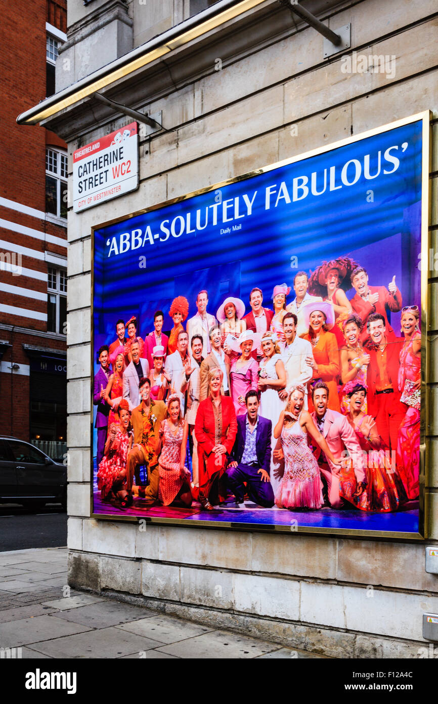 'Abba-solutely fabulous' review poster on wall of Catherine Street for Mamma Mia musical at Novello Theatre in London's West End Stock Photo
