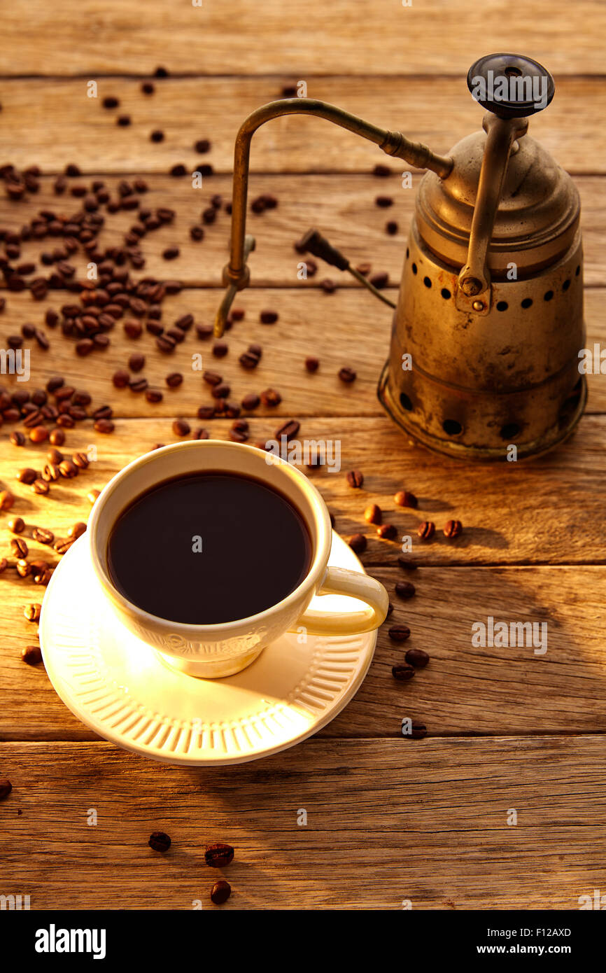 Coffee with vintage machine on aged wooden table Stock Photo - Alamy