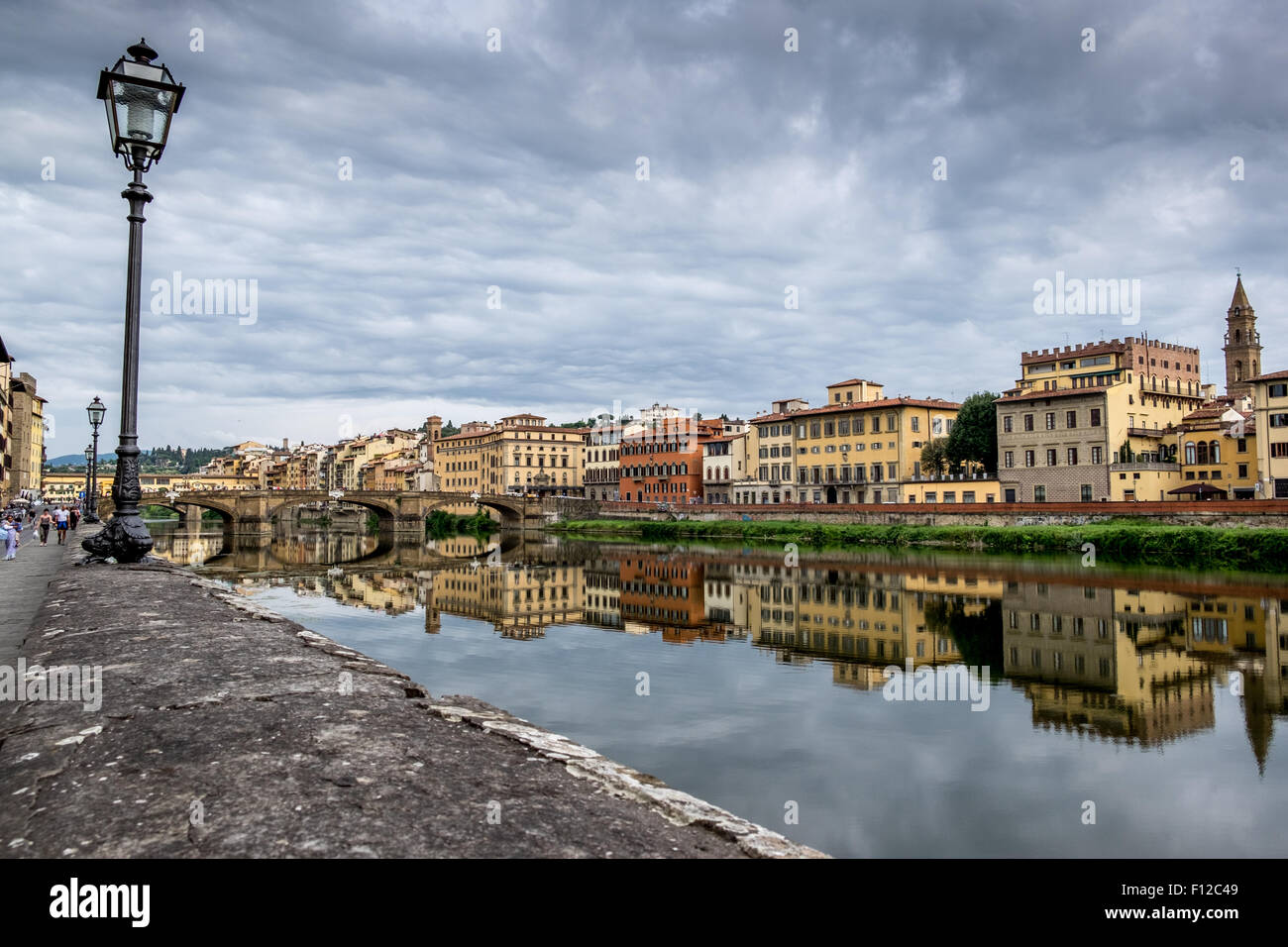 Riverside view along the river Arno looking towards Ponte Vecchio, florence Italy Stock Photo