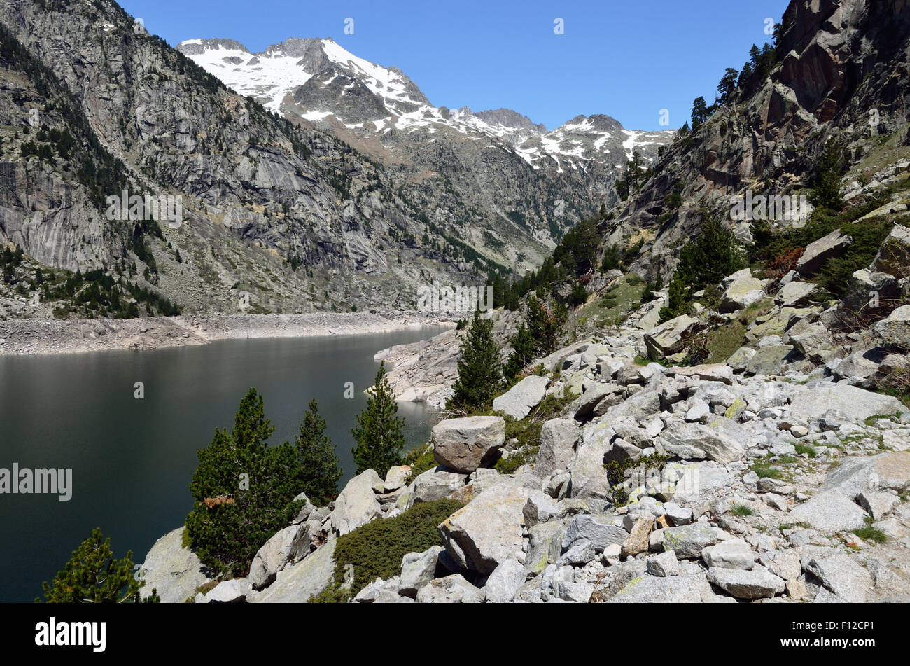 Hiking trail along the mountain lake Stock Photo