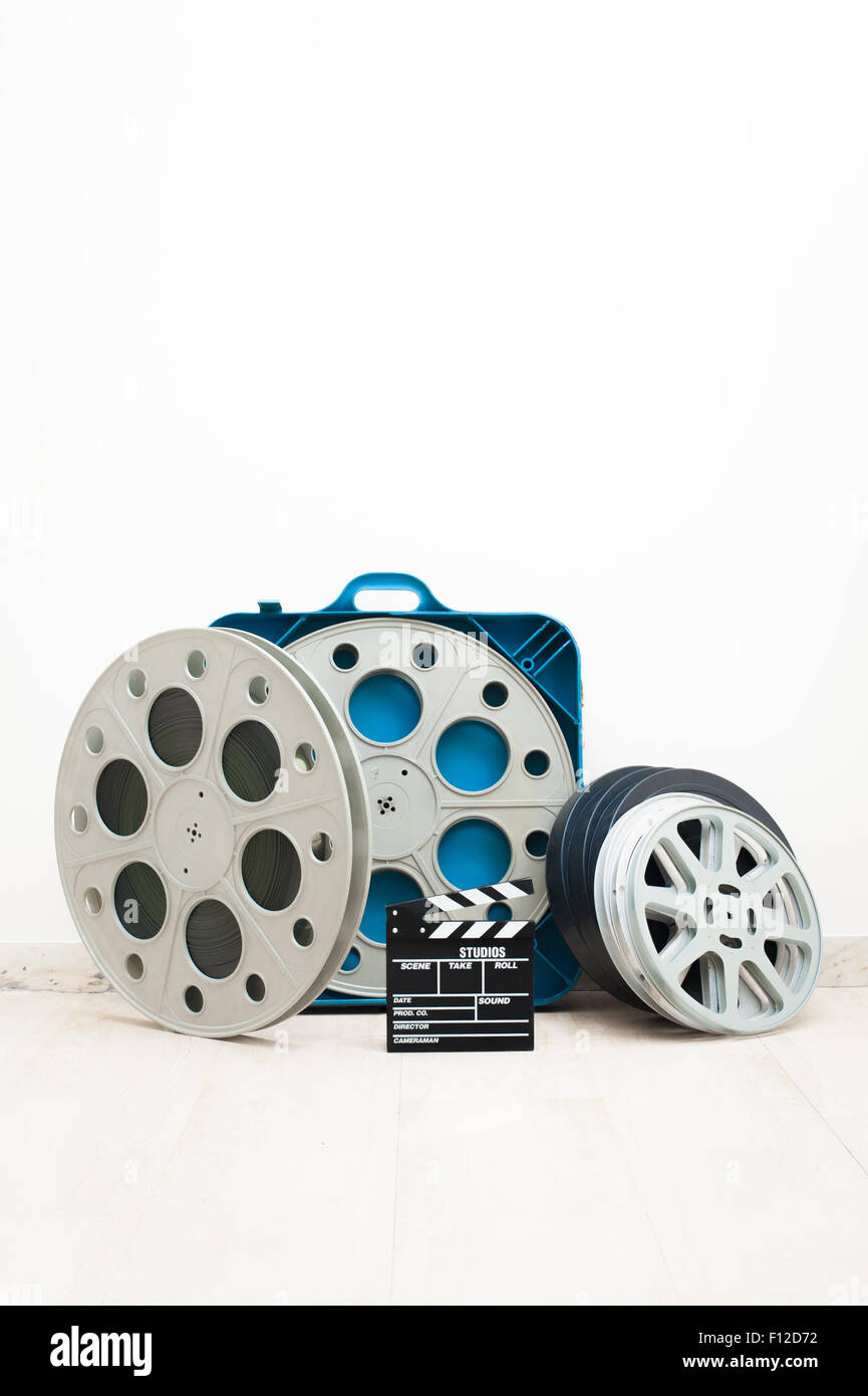 Movie Clapper On 35 Mm Film Reels Isolated Vertical Stock Photo - Download  Image Now - iStock