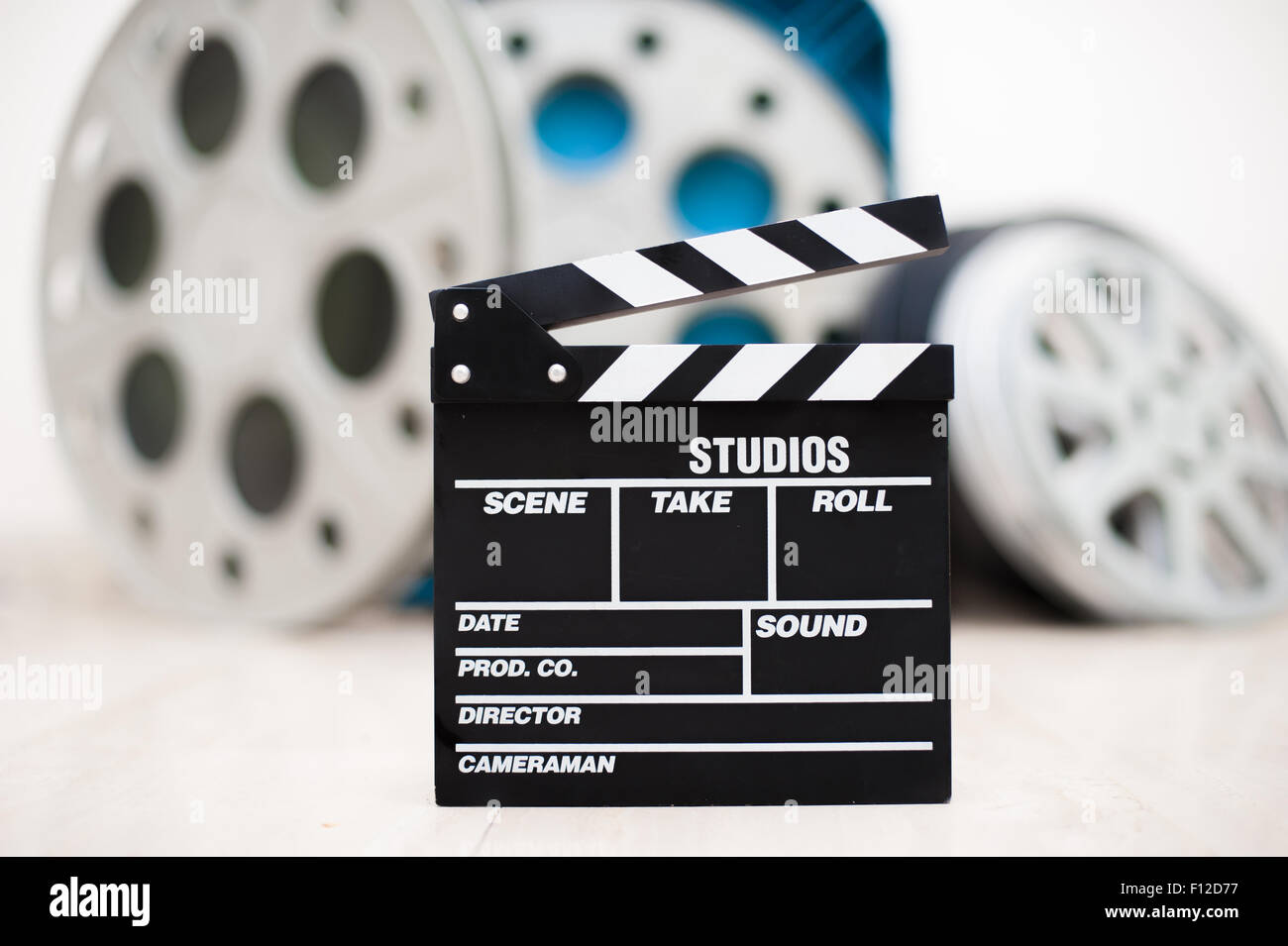 A Film Reel in a Box on a Blue Background · Free Stock Photo
