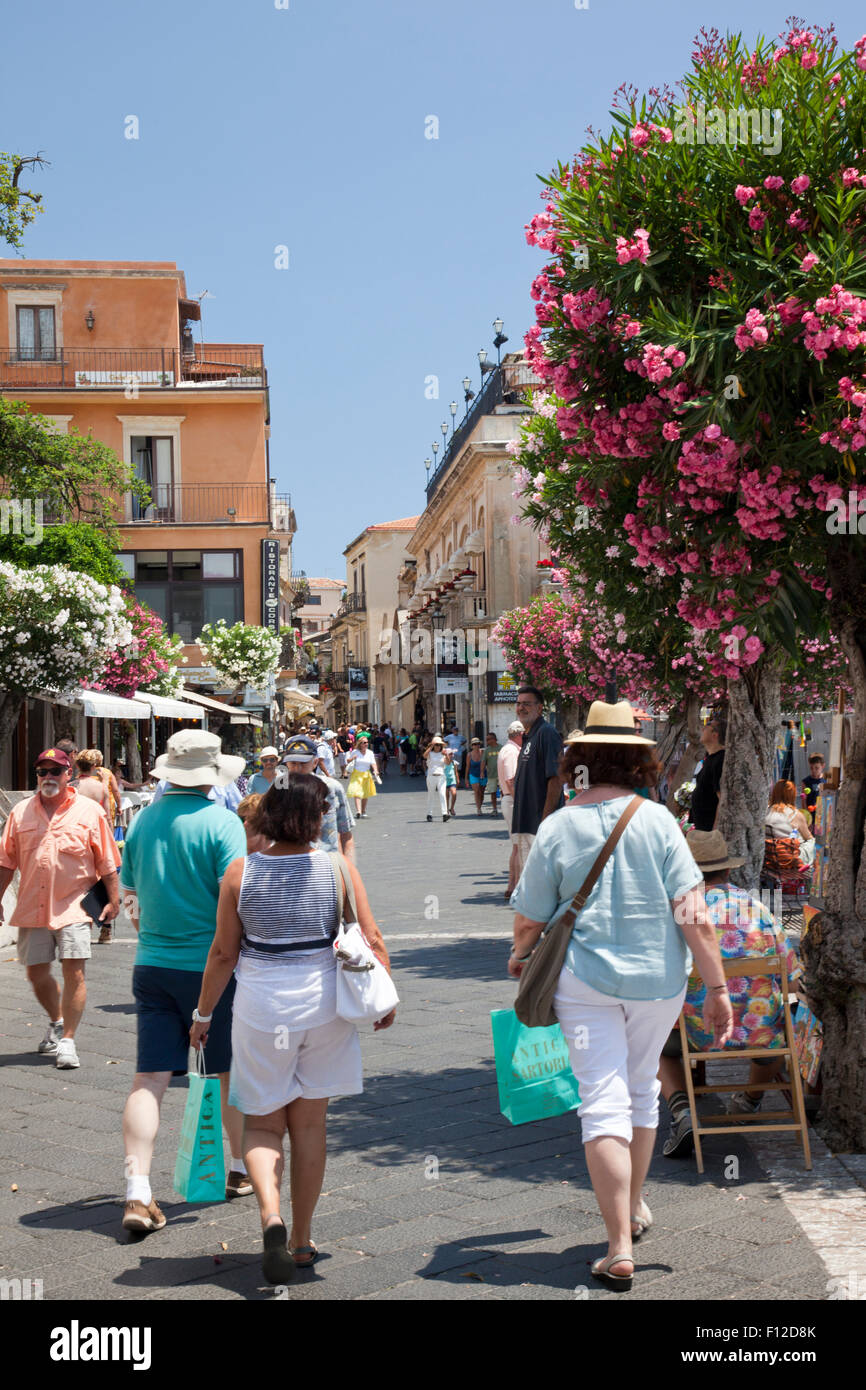 People walking along Corso Umberto - Taormina main street, Sicily, Italy Stock Photo