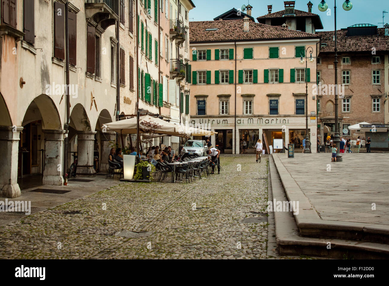 Udine, Italy August 12, 2014 people spend some time in the many bars