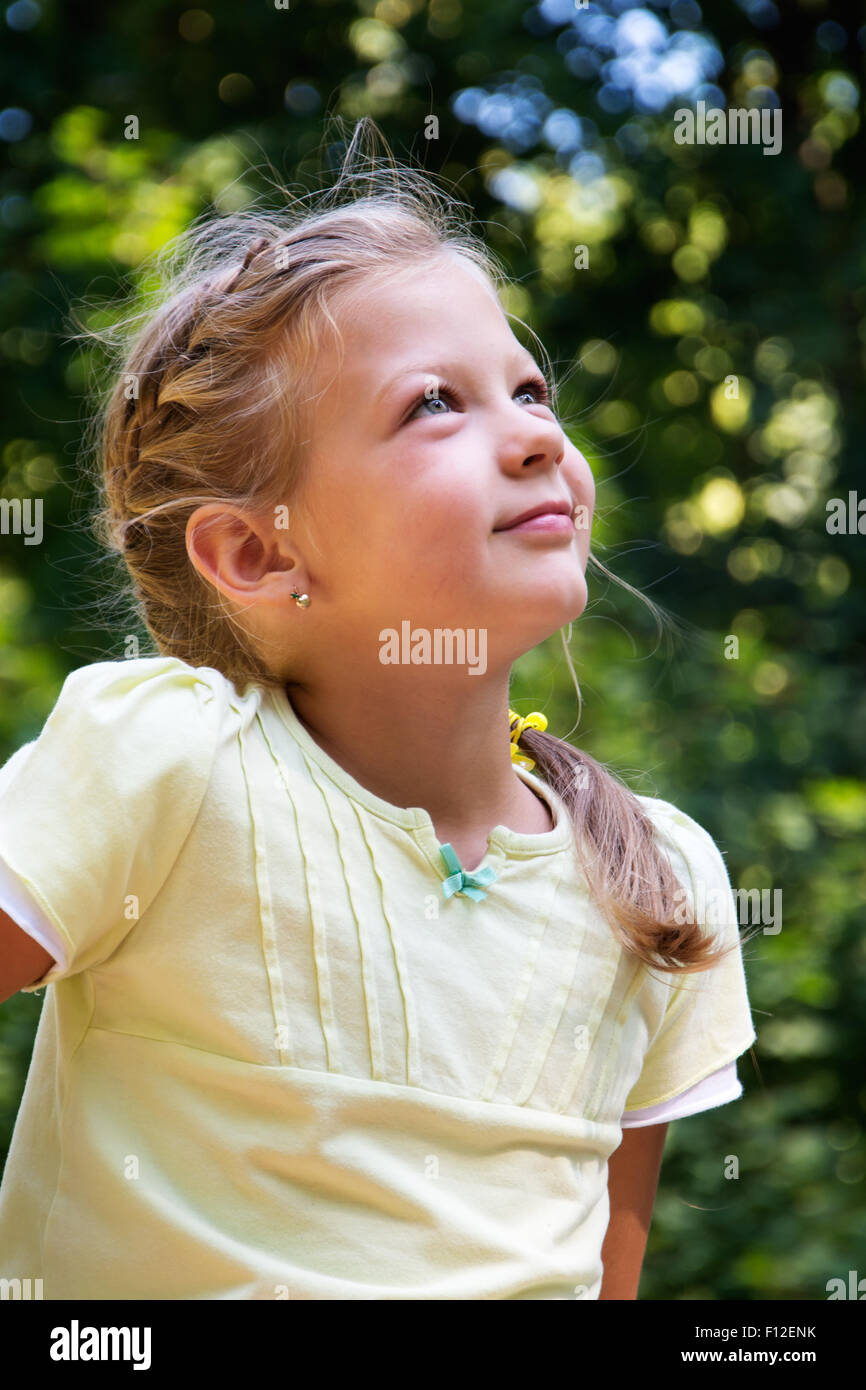 Portrait of a beautiful little girl in the forest Stock Photo - Alamy