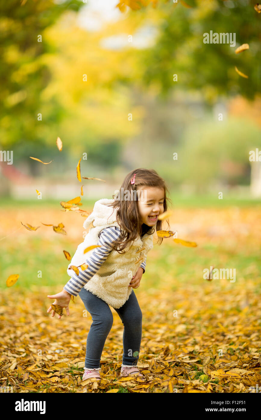 Little girl at the autumn park Stock Photo - Alamy