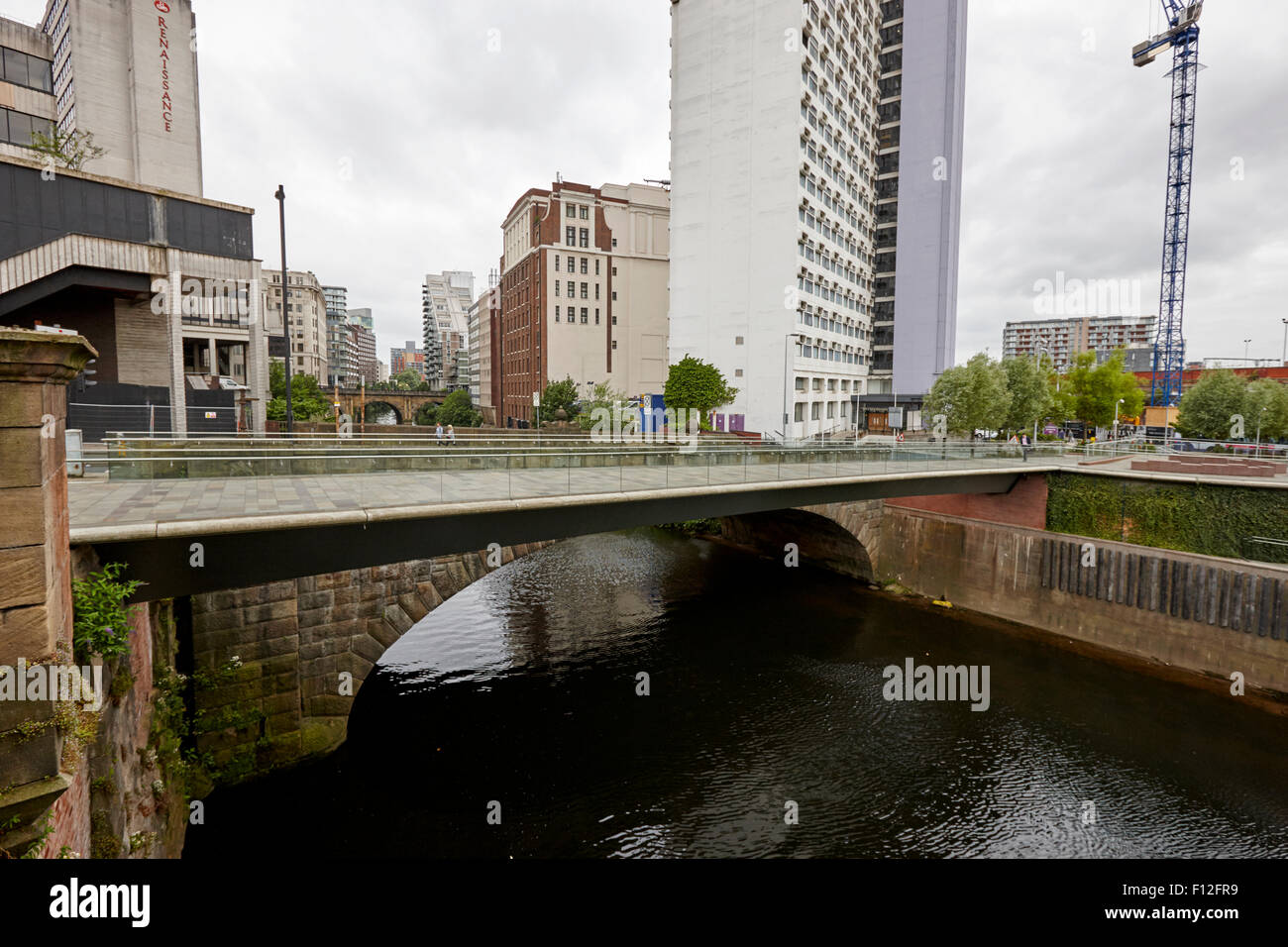 new footbridge and victoria stone bridge over the river irwell between