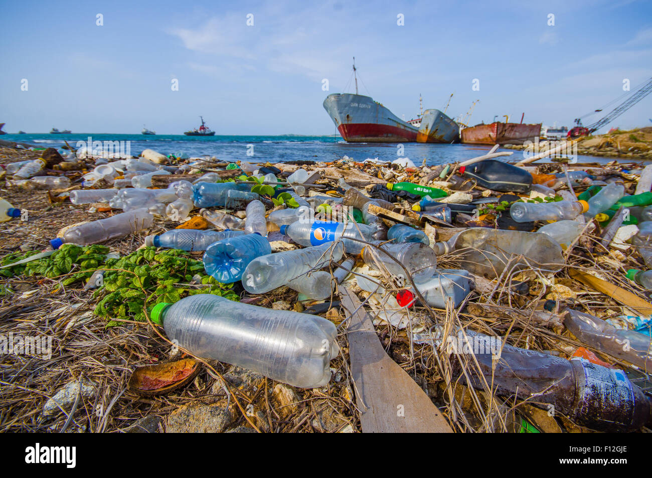 COLON, PANAMA - APRIL 15, 2015: Waste and pollution washing on the