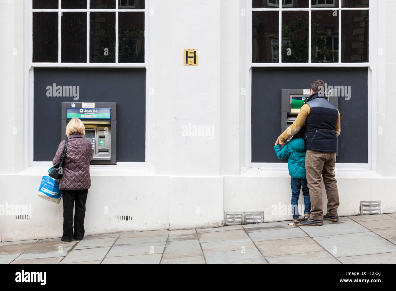 People at LLoyds TSB bank cash machines (ATMs), Nottingham, England, UK Stock Photo