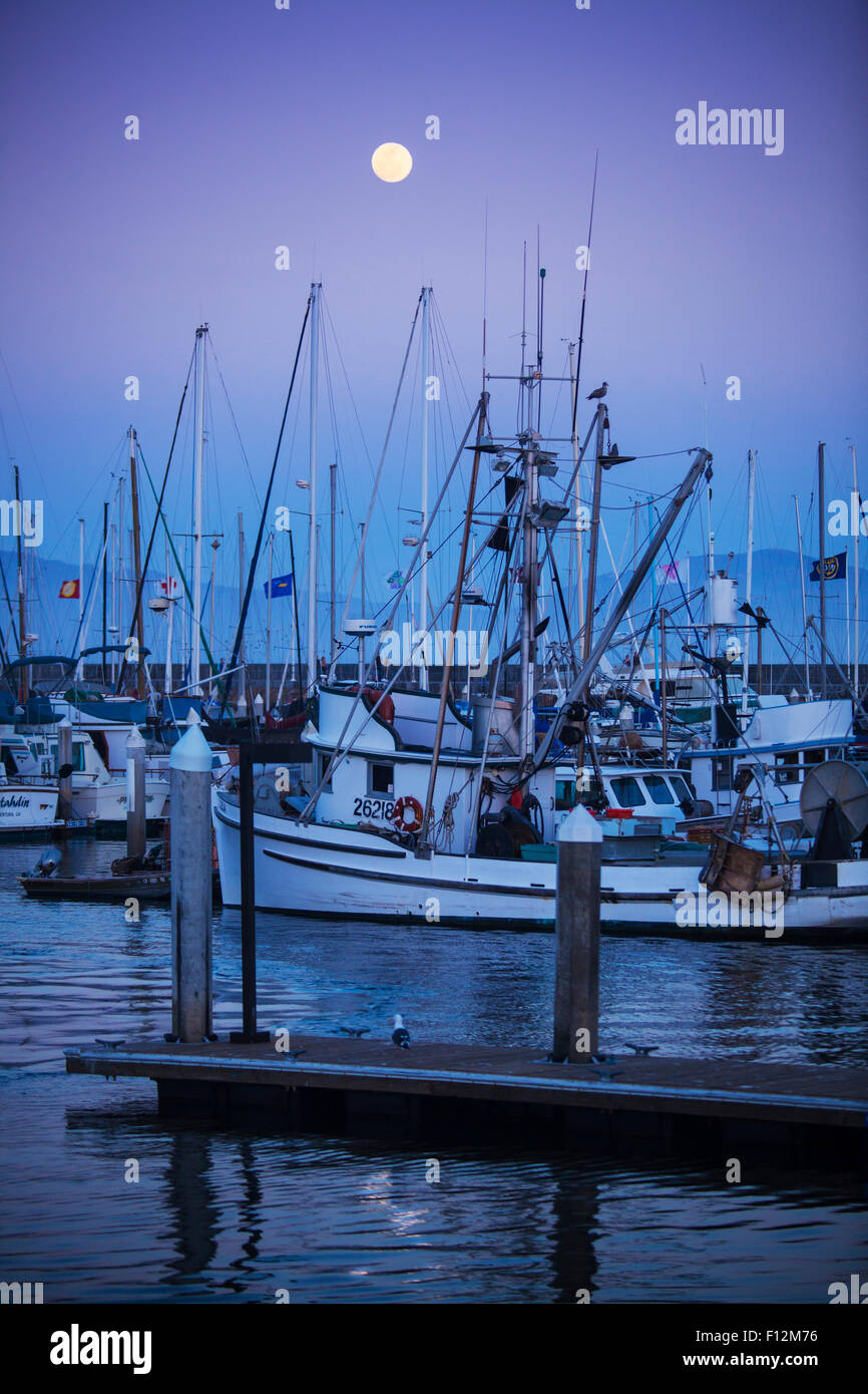 moonrise over commercial fishing boats in Santa Barbara Harbor, Santa Barbara, California Stock Photo