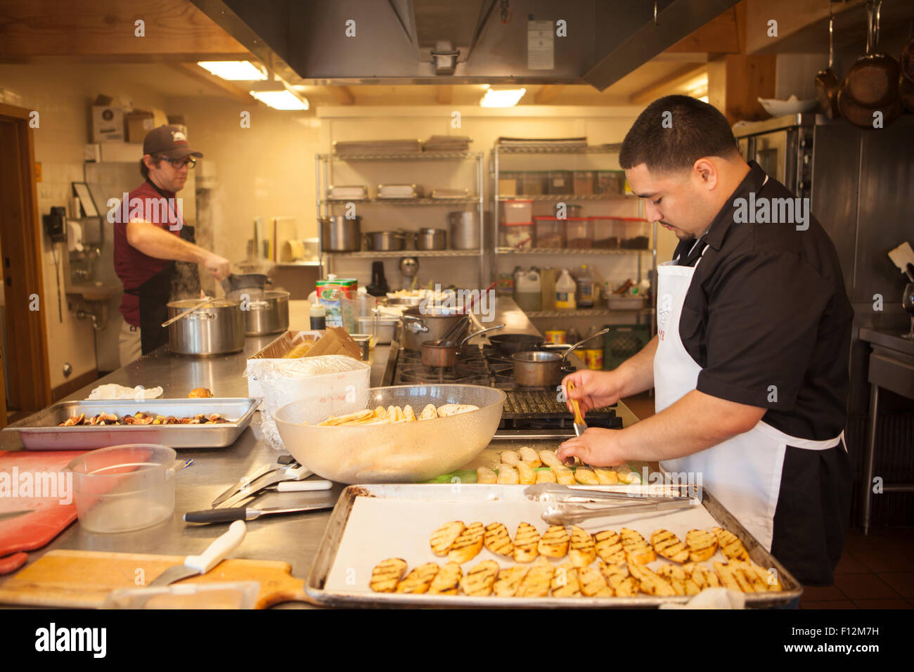 chefs prepare to grill bread for a special dinner, Members’ Dinner at Roblar Winery, Santa Ynez Valley, California Stock Photo