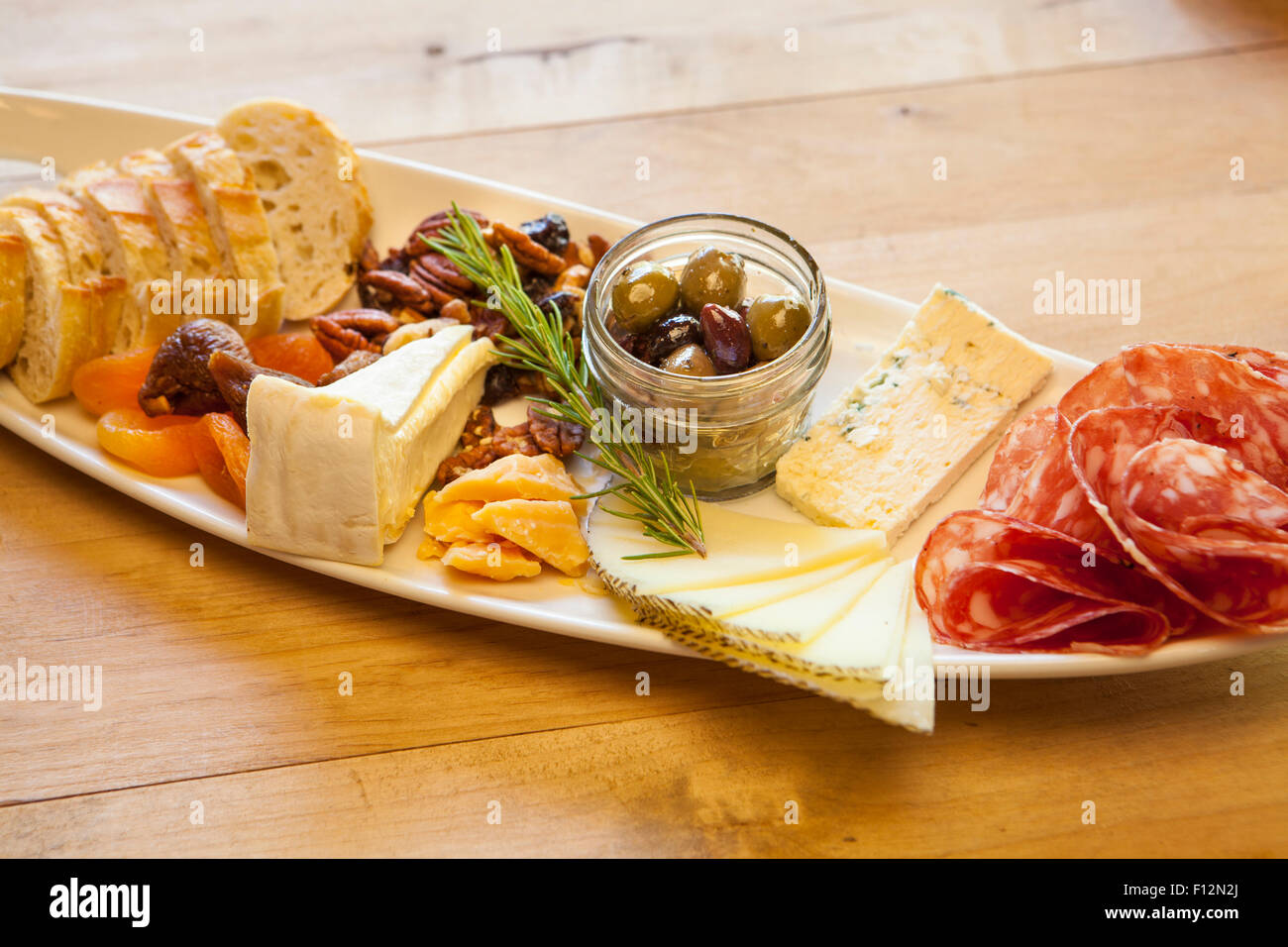 dish of salami, cheese, nuts, fruit and bread, Roblar Winery, Santa Ynez Valley, California Stock Photo