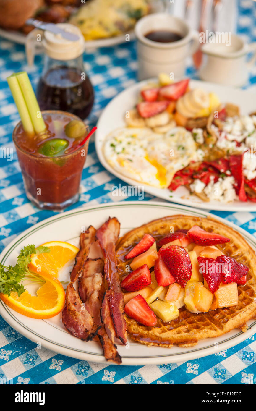 O.J.Waffle with bacon, Huevos Paradiso, a Paloma Omlette, coffee and a Bloody Mary, The Paradise Cafe, Santa Barbara, California Stock Photo