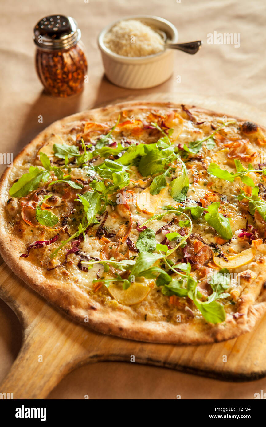 six cheese flatbread pizza with pancetta, apple, caramelized onions and