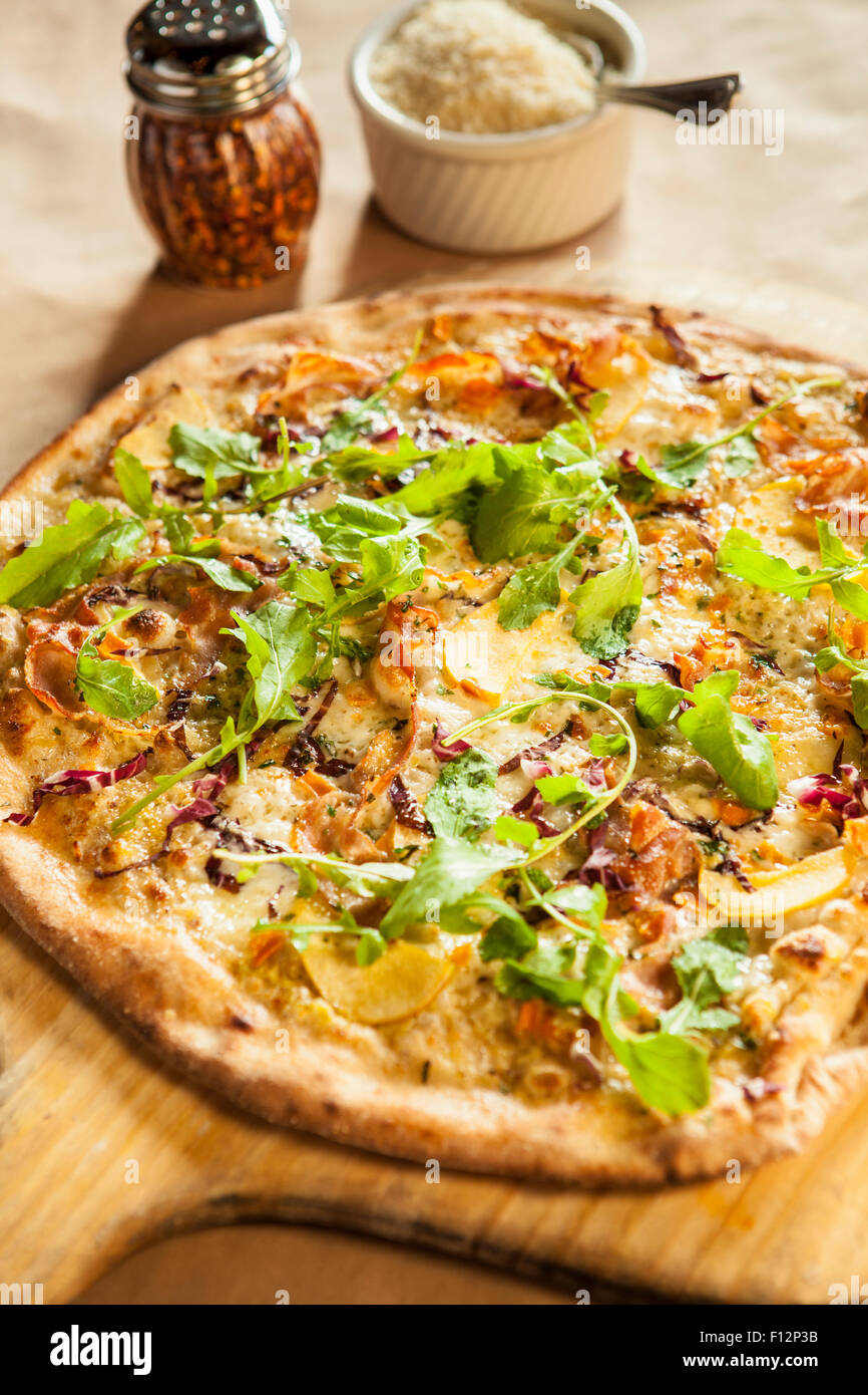 six cheese flatbread pizza with pancetta, apple, caramelized onions and