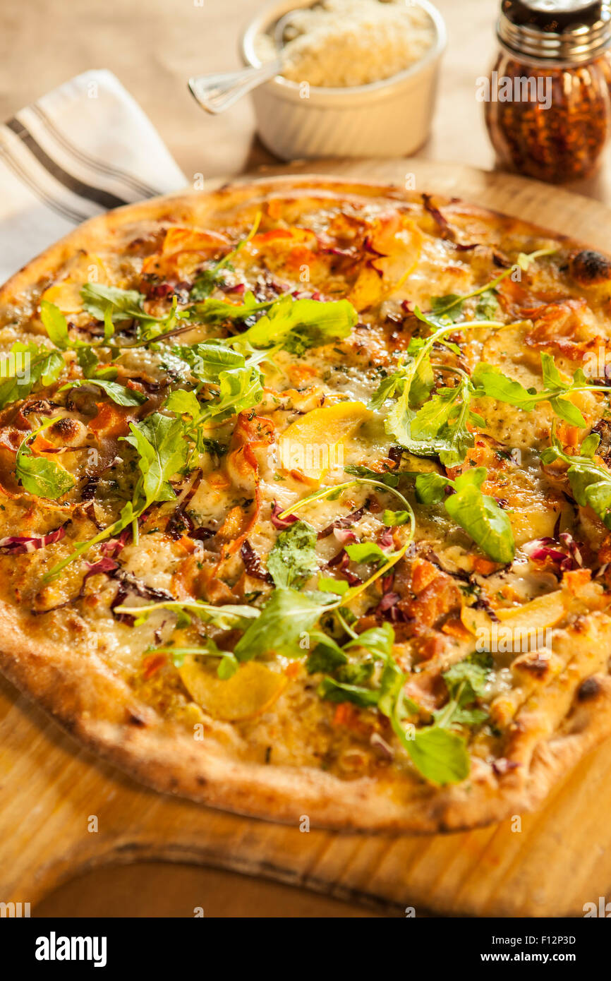 six cheese flatbread pizza with pancetta, apple, caramelized onions and