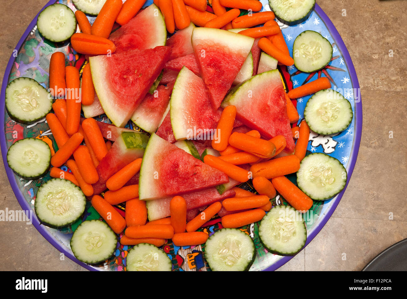 Decorative fruit and vegetable snack platter of watermelon wedges