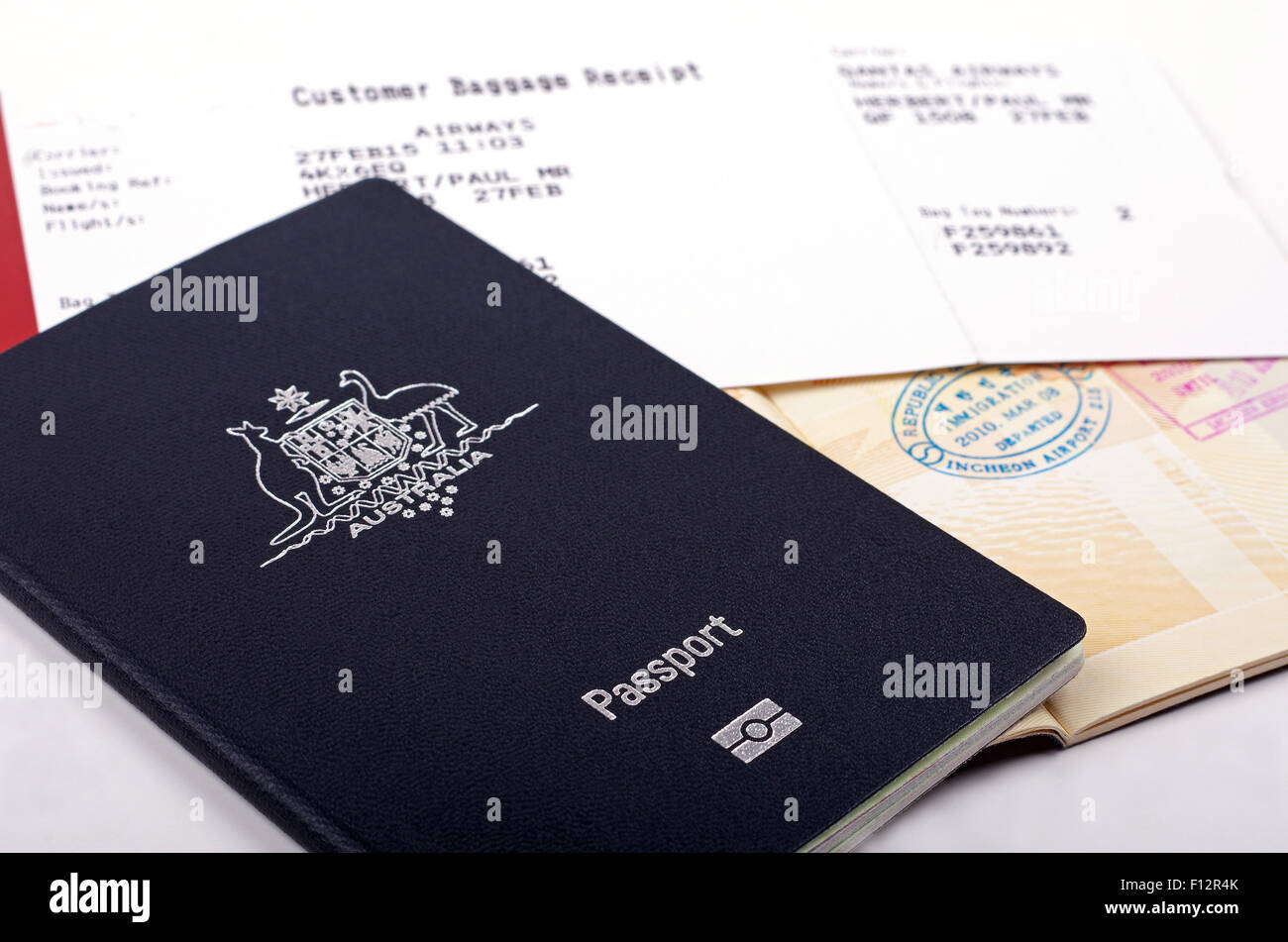 australian passport and immigration stamps with a airline baggage receipt Stock Photo