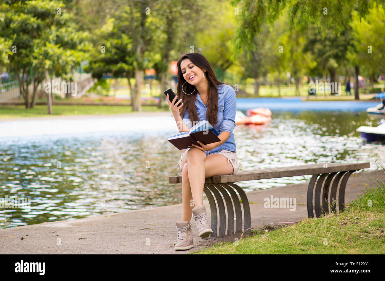 Brunette Model Wearing Denim Shirt And White Shorts Relaxing In