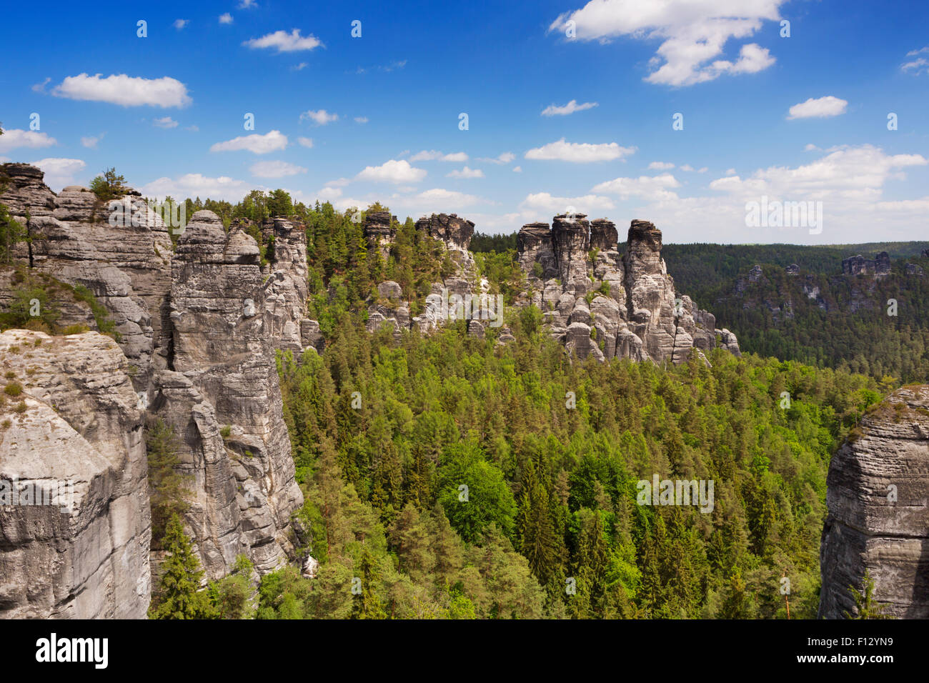 Rock formations at the Bastei in the Saxon Switzerland region in Germany. Photographed on a bright and sunny day. Stock Photo