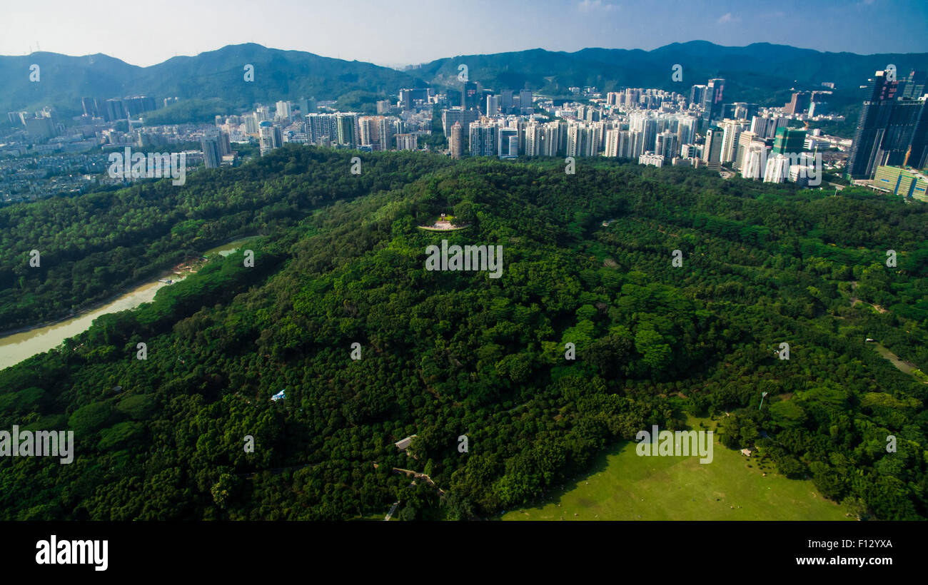Shenzhen. 23rd Aug, 2015. An aerial photo taken on Aug. 23, 2015 shows the scenery of Lianhua Mountain in Shenzhen, south China's Guangdong Province. Shenzhen Special Economic Zone, established on Aug. 26 in 1980 and situated immediately north of Hong Kong Special Administrative Region, is China's first and one of the most successful Special Economic Zones. © Mao Siqian/Xinhua/Alamy Live News Stock Photo