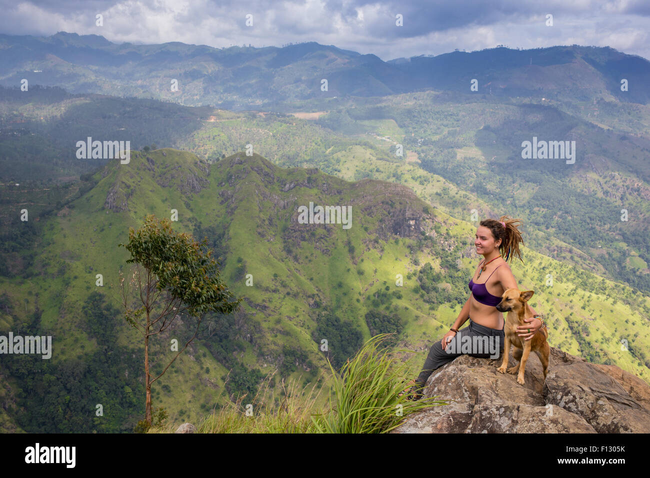 Trendy Hipster Girl with her Dog on Urban Background Stock Photo - Alamy