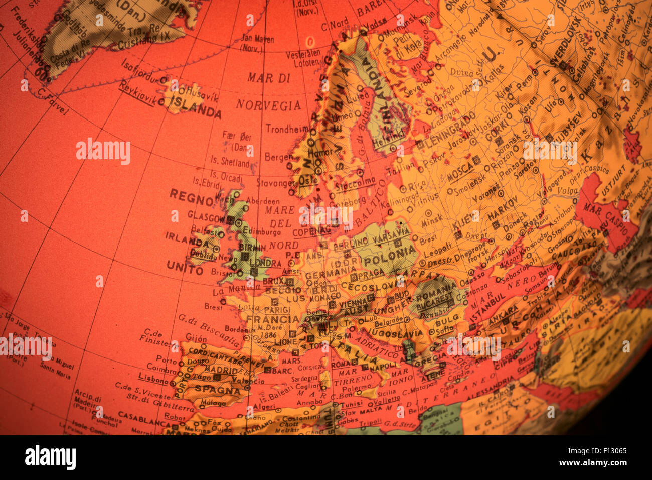 MILAN, ITALY - DECEMBER 17, 2014: red light world globe illuminated from within with closeup on Europe Stock Photo