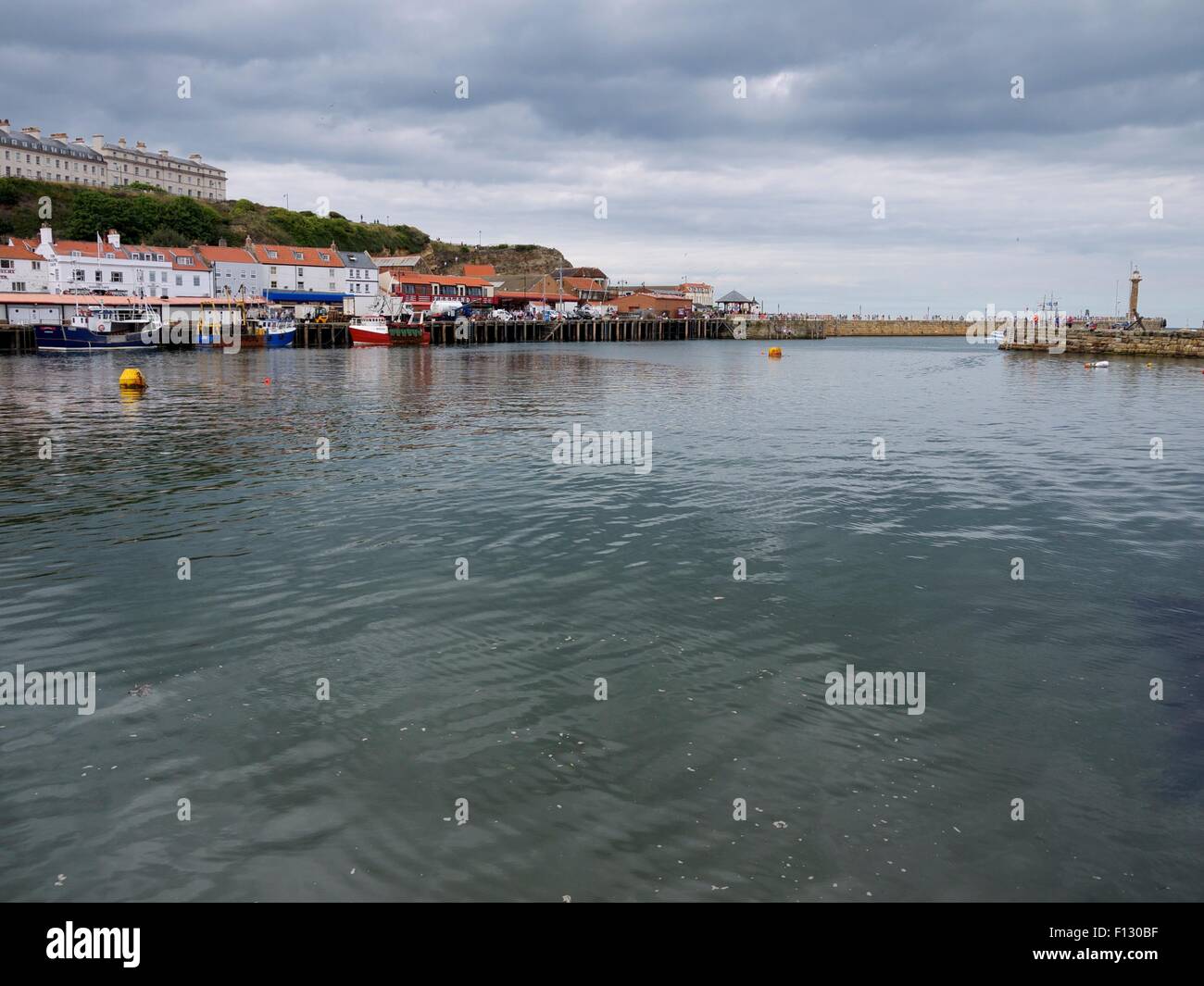 Whitby lighthouse and harbor Stock Photo