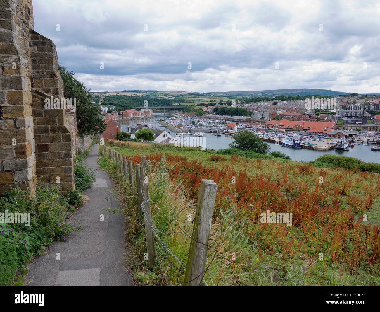 Path leading down to Whitby and the start of the yorkshire dales in the background Stock Photo