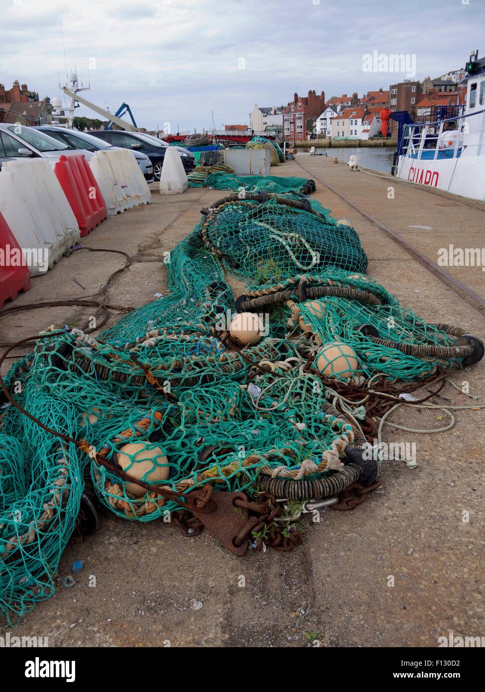Fishing net in a long line on dry land Stock Photo
