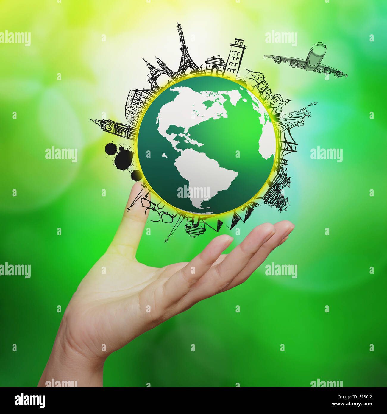 hand showing airplane traveling around the world on green nature background as concept Stock Photo