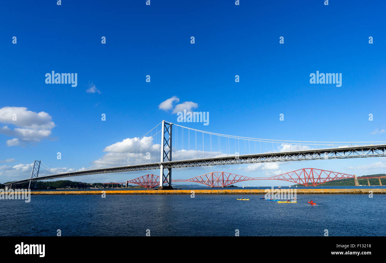 View of Forth Road Bridge and Forth Rail Bridge crossing the River Forth from South Queensferry in Scotland United Kingdom Stock Photo