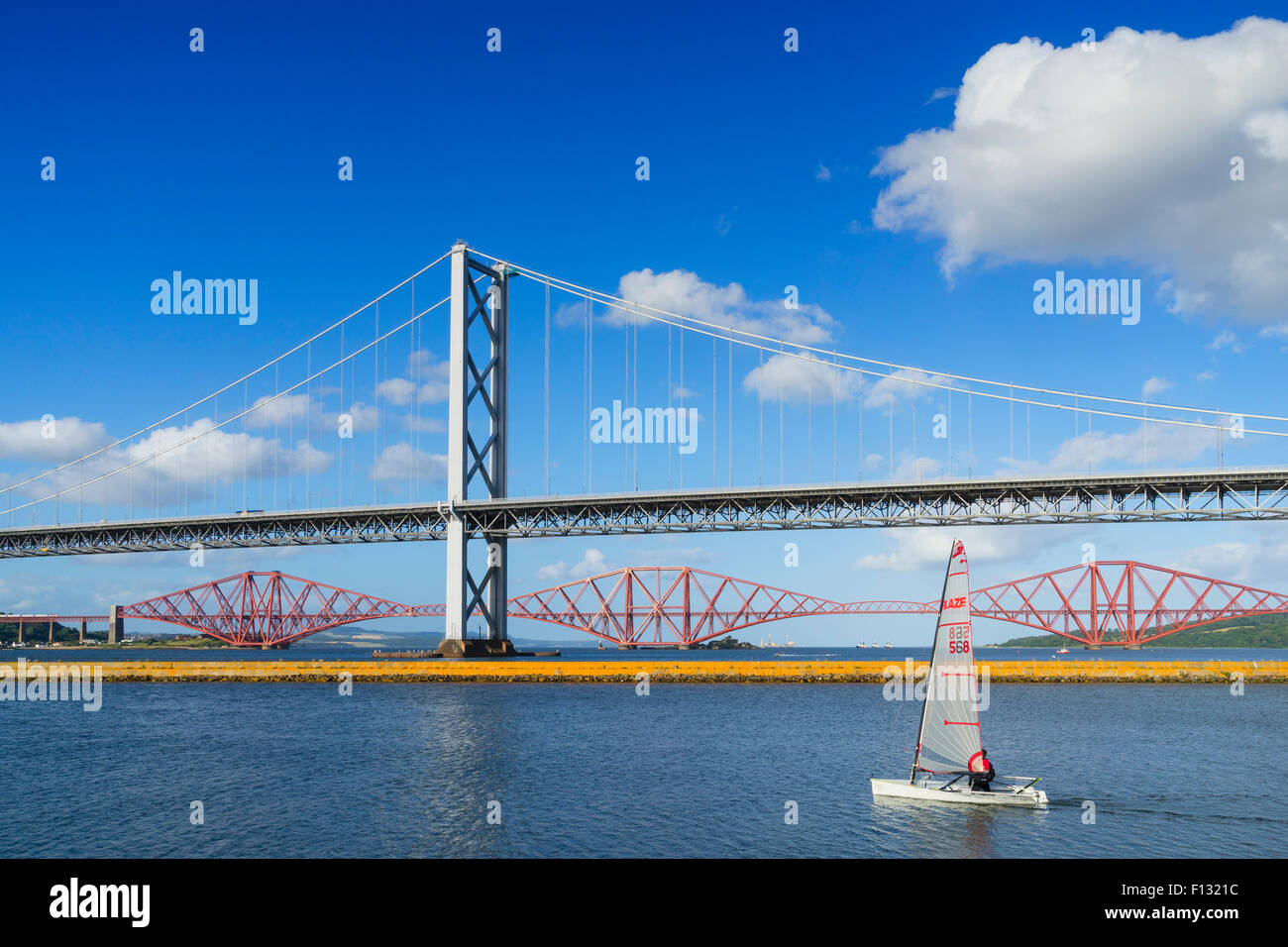 View of Forth Road Bridge and Forth Rail Bridge crossing the River Forth from South Queensferry in Scotland United Kingdom Stock Photo