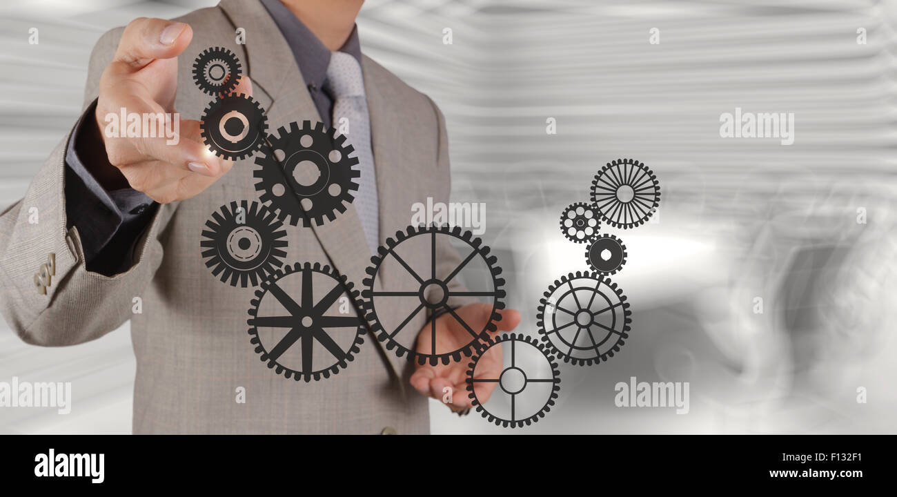 businessman hand draws gear to success concept Stock Photo - Alamy
