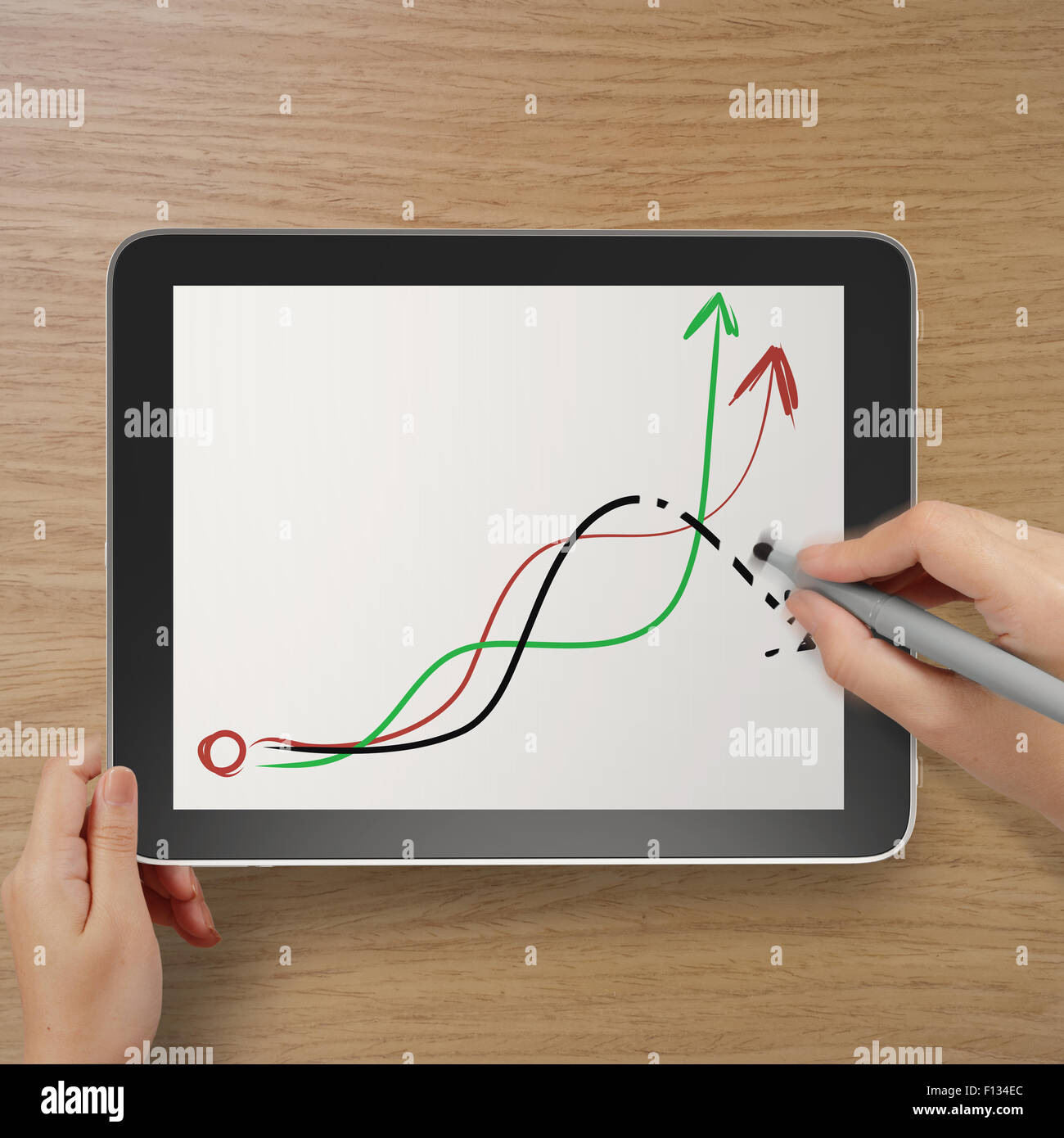 hand with stylus and eraser deleting falling graph business as concept Stock Photo