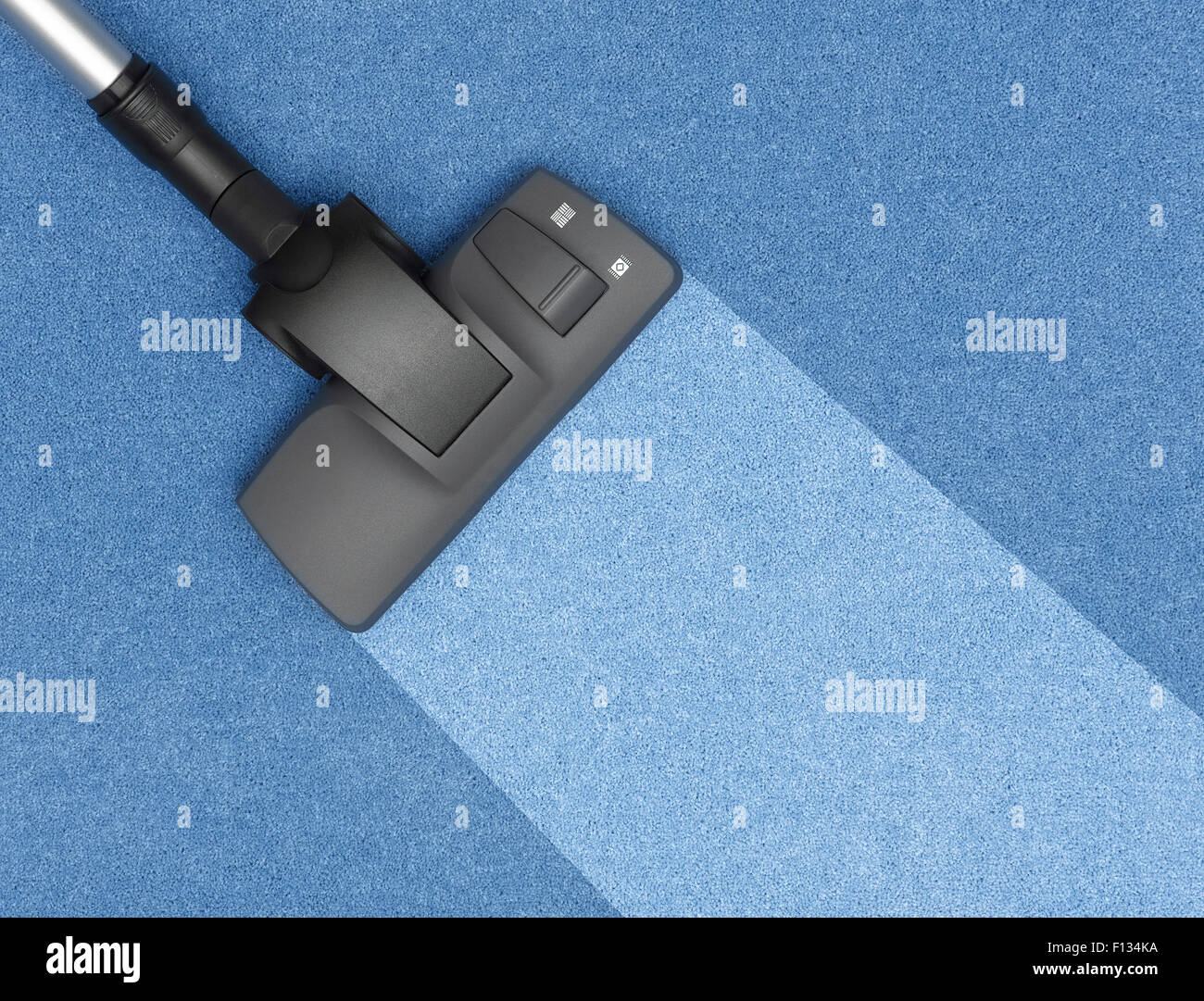 Vacuum Cleaner cleaning the carpet Stock Photo Alamy