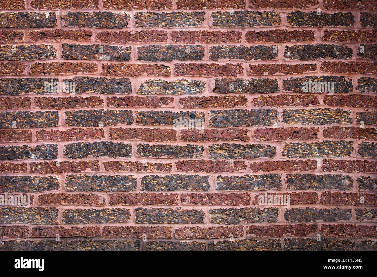 Laterite stone brick wall, bricklaying Indian style Stock Photo