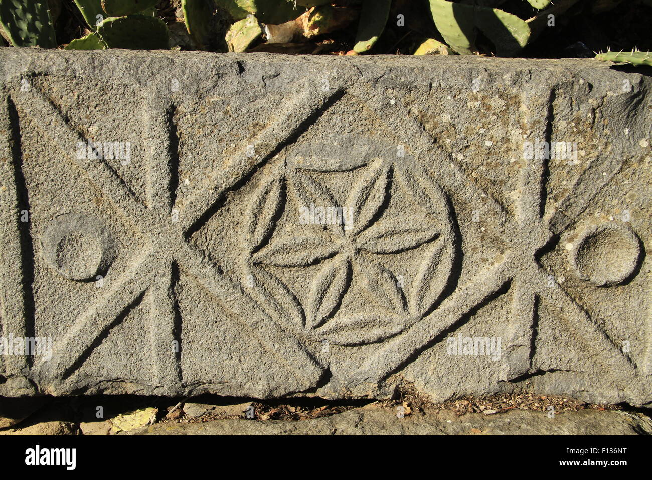 Golan Heights, engraved rosetta on a stone at the ancient Synagogue in Katzrin Stock Photo
