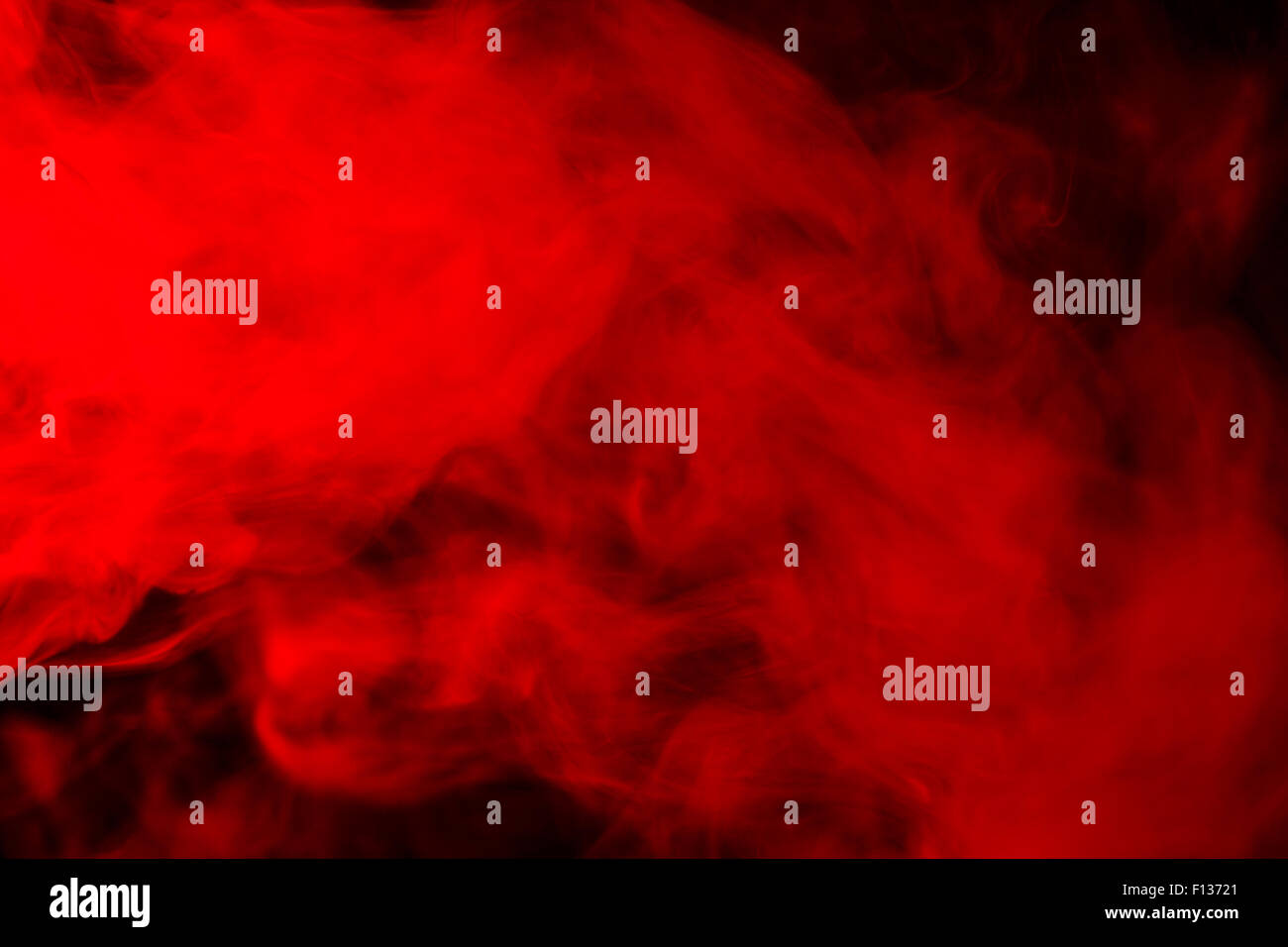 Abstract red-orange hookah smoke on a black background. Photographed