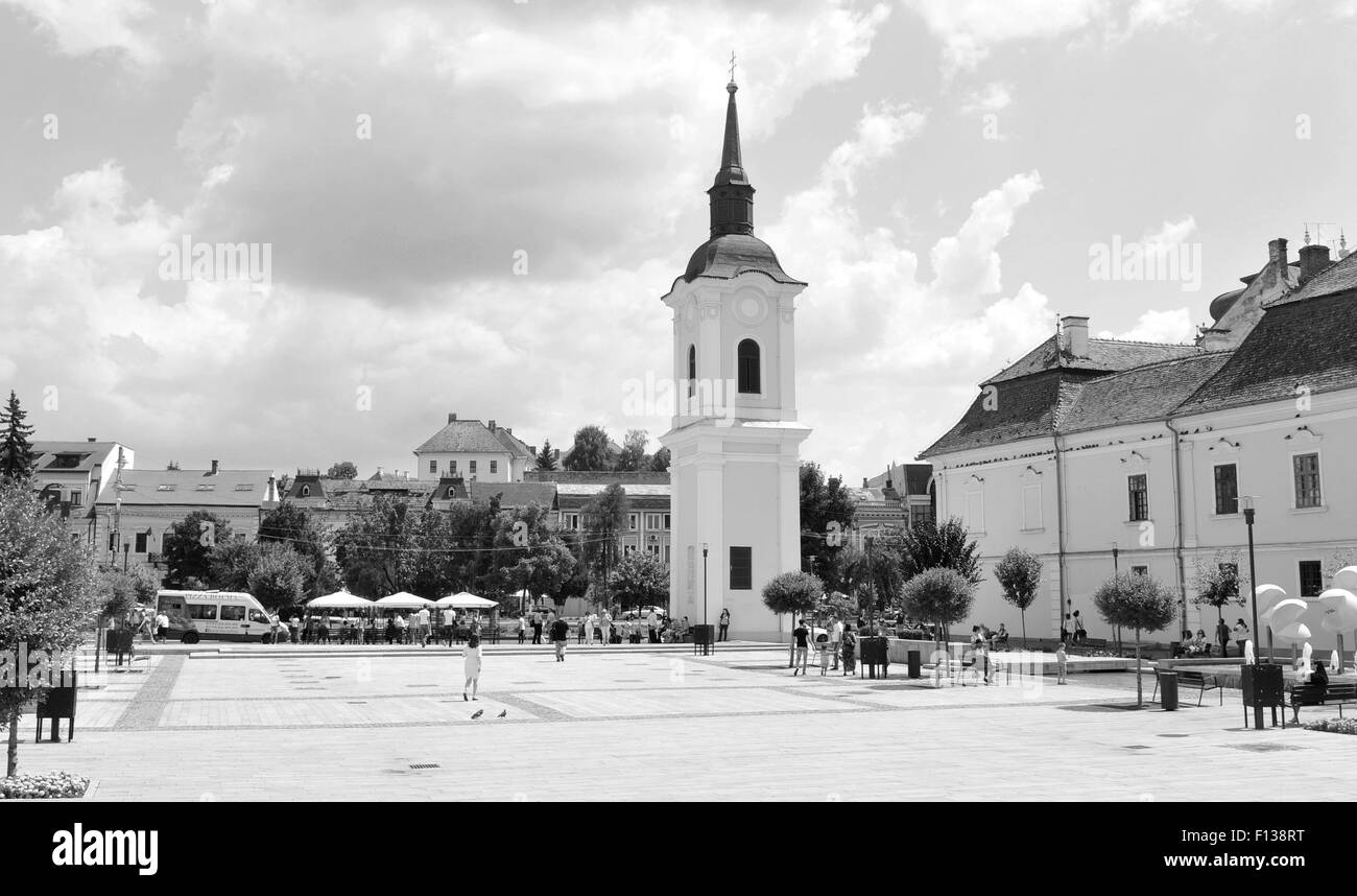 Targu Mures, Romania - July 2, 2015: Tourists admire the old architecture in the city centre of Targu Mures Stock Photo
