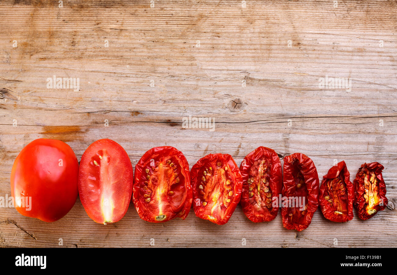 Sequential stages of tomato drying from fully fresh to almost