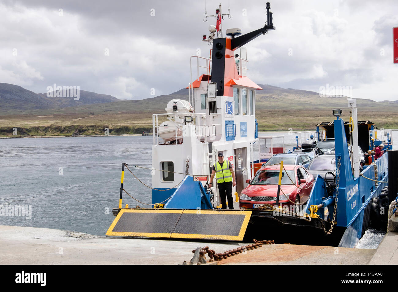 Jura ferry Eilean Dhiura docking in Sound of Islay at Port Askaig, Isle of Islay, Inner Hebrides, Western Isles, Scotland, UK Stock Photo