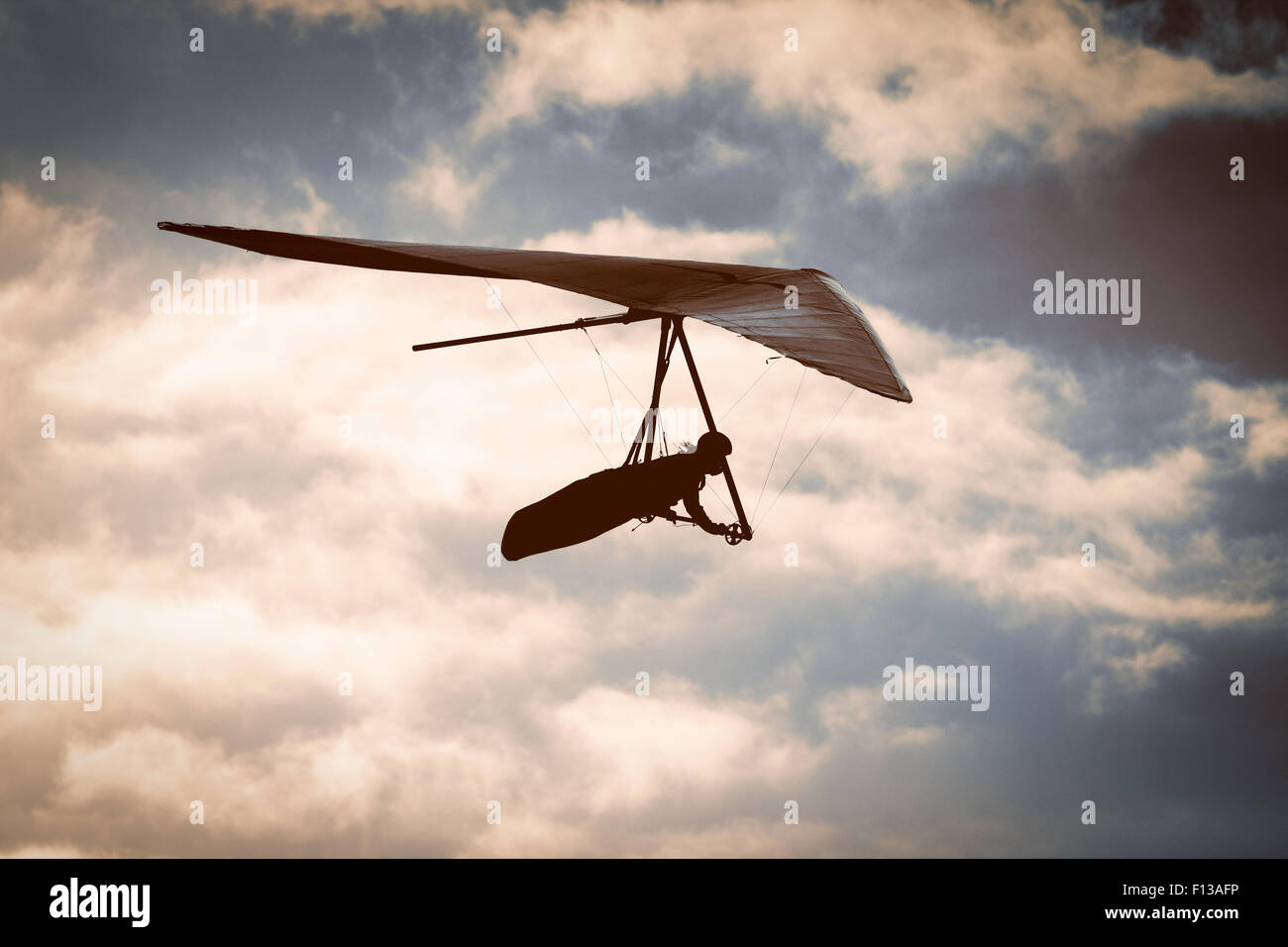 Hang glider at sunset Stock Photo